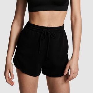 PINK IVY FLEECE CURVED
HEM SHORTS